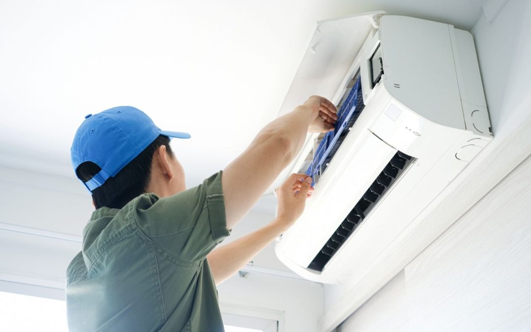 HVAC technician servicing a ductless mini split in Olivehurst