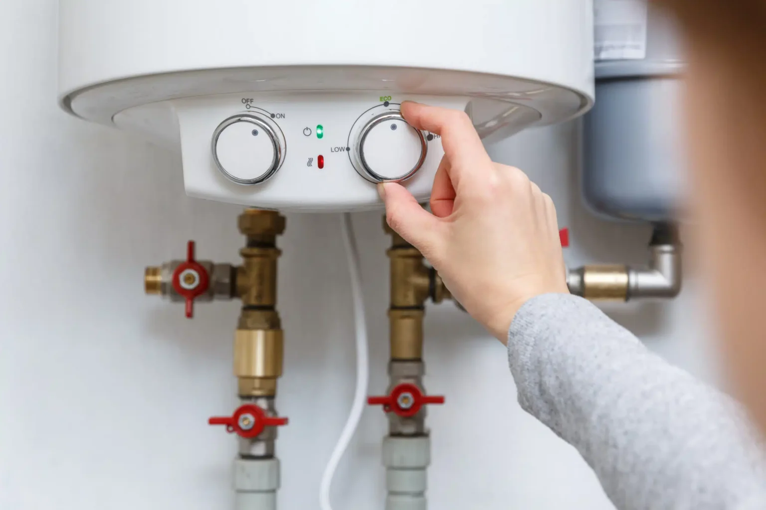 Technician adjusting a water heater in Olivehurst